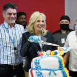 
              First lady Jill Biden cuts a cake with George Ciolache, the cake maker, as she meets with U.S. troops during a visit to the Mihail Kogalniceanu Air Base in Romania, Friday, May 6, 2022. (AP Photo/Susan Walsh, Pool)
            