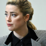 
              Actor Amber Heard appears in the courtroom at the Fairfax County Circuit Courthouse in Fairfax, Va., Tuesday, May 24, 2022. Depp sued his ex-wife Amber Heard for libel in Fairfax County Circuit Court after she wrote an op-ed piece in The Washington Post in 2018 referring to herself as a "public figure representing domestic abuse." (Jim Watson/Pool photo via AP)
            