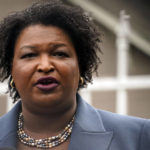 
              Georgia Democratic gubernatorial candidate Stacey Abrams talks to the media during Georgia's primary election on Tuesday, May 24, 2022, in Atlanta. (AP Photo/Brynn Anderson)
            