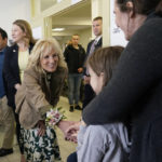 
              First lady Jill Biden meets Ukrainian refugees Victorie Kutocha and her daughter Yulie Kutocha, 7, at a city-run refugee center in Kosice, Slovakia, Sunday, May 8, 2022. The center is a place for Ukrainian refugees to rest and prepare for onward travel. Biden will then travel to the Slovak border with Ukraine to meet with refugees. (AP Photo/Susan Walsh, Pool)
            