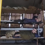 
              In this photo taken from video released by the Russian Defense Ministry Press Service on Tuesday, May 17, 2022, wounded Ukrainian servicemen lay in a bus as they are being evacuated as they are being evacuated from the besieged Azovstal steel plant in Mariupol, Ukraine. More than 260 fighters, some severely wounded, were pulled from a steel plant on Monday that is the last redoubt of Ukrainian fighters in the city and transported to two towns controlled by separatists, officials on both sides said. (Russian Defense Ministry Press Service via AP)
            