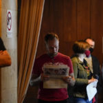 
              People wait in line to vote in the Georgia's primary election on Tuesday, May 24, 2022, in Atlanta. (AP Photo/Brynn Anderson)
            