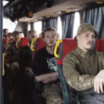 
              In this photo taken from video released by the Russian Defense Ministry Press Service on Tuesday, May 17, 2022, Ukrainian servicemen sit in a bus as they are being evacuated from the besieged Azovstal steel plant in Mariupol, Ukraine. More than 260 fighters, some severely wounded, were pulled from a steel plant on Monday that is the last redoubt of Ukrainian fighters in the city and transported to two towns controlled by separatists, officials on both sides said. (Russian Defense Ministry Press Service via AP)
            