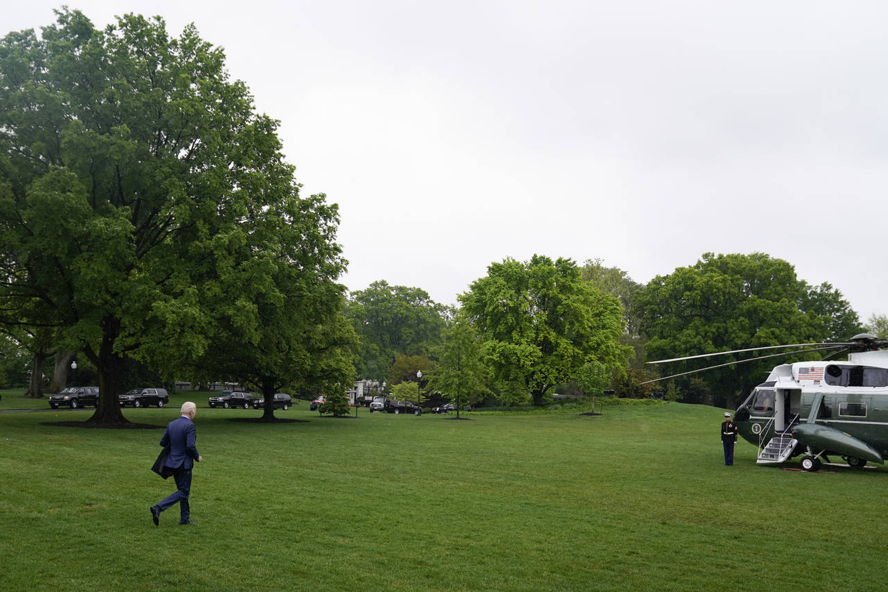 President Joe Biden walks to board Marine One on the South Lawn of the White House, Friday, May 6, ...