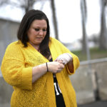 
              Katie Wright holds the hand on her injured wrist before a news conference Thursday, May 5, 2022 outside the Brooklyn Center Police Station in Brooklyn Center, Minn. Katie Wright, the mother of Daunte Wright, said she was injured while she was briefly detained by one of the same department’s officers after she stopped to record an arrest of a person during a traffic stop.  (Aaron Lavinsky /Star Tribune via AP)
            