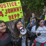 
              Supporters of actor Johnny Depp rally outside of Fairfax County Courthouse as a jury is scheduled to hear closing arguments in Johnny Depp's high-profile libel lawsuit against ex-wife Amber Heard in Fairfax, Va., on Friday, May 27, 2022.(AP Photo/Craig Hudson)
            