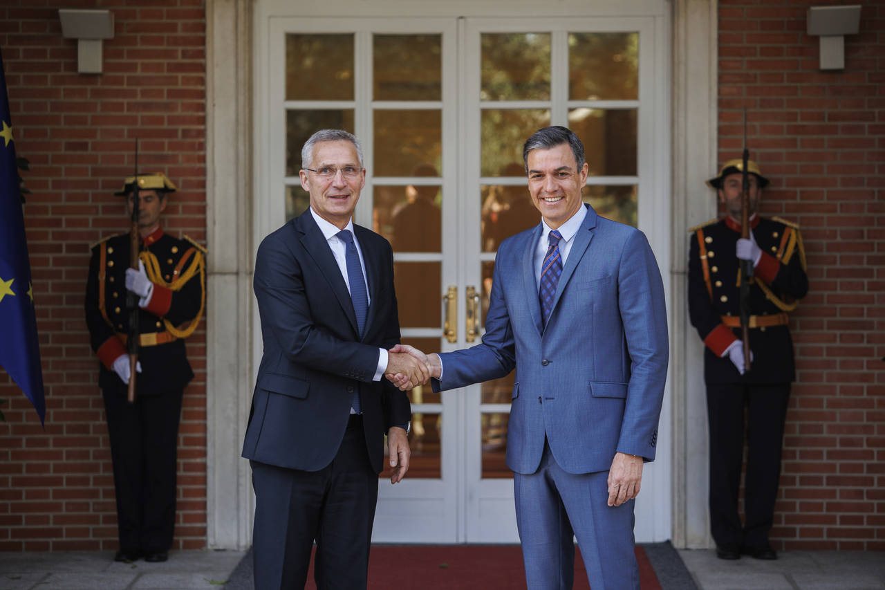 NATO Secretary General Jens Stoltenberg, left, shakes hand with Spanish Prime Minister Pedro Sánch...