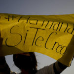 
              A woman holds a banner with a message reading in Spanish; "Sister, I do believe you" during a protest outside the San Bernardo Convent, in Salta, Argentina, Tuesday, May 3, 2022. Several feminist groups protested in support of the eighteen cloistered nuns from the convent who have made a formal allegation against the Archbishop Mario Cargnello of Salta and two other members of the church for alleged physical and psychological gender violence.  (AP Photo/Natacha Pisarenko)
            