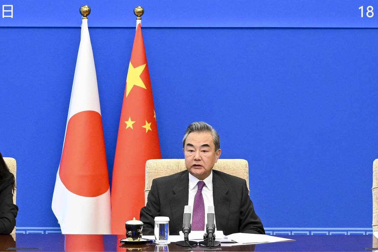 In this photo released by Xinhua News Agency, Chinese Foreign Minister Wang Yi speaks during meetin...