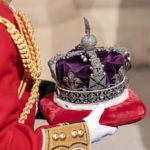 
              The Imperial State Crown is carried through the Sovereign's Entrance ahead of the State Opening of Parliament at Houses of Parliament, in London, Tuesday, May 10, 2022. Britain’s Parliament opens a new year-long session on Tuesday with a mix of royal pomp and raw politics, as Prime Minister Boris Johnson tries to re-energize his scandal-tarnished administration and revive the economy amid a worsening cost-of-living crisis. (Chris Jackson/Pool Photo via AP)
            