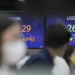
              Currency traders watch computer monitors near the screens showing the Korea Composite Stock Price Index (KOSPI), left, and the foreign exchange rate between U.S. dollar and South Korean won at a foreign exchange dealing room in Seoul, South Korea, Wednesday, May 4, 2022. Shares were mostly lower in Asia ahead of a interest rate decision by the Federal Reserve later Wednesday, with markets in China, Japan and some other markets still closed for holidays. (AP Photo/Lee Jin-man)
            