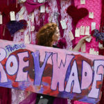 
              FILE - Jacqueline von Edelberg holds a sign with other abortion rights demonstrators May 14, 2022, in Chicago. Reproductive rights advocates are planning to open new abortion clinics or expand the capacity of existing ones in states without restrictive abortion laws. (AP Photo/Matt Marton, File)
            