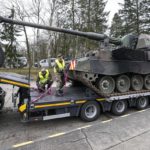 
              FILE - German soldiers load tank howitzers 2000 for transport to Lithuania at the Bundeswehr army base in Munster, northern Germany, Monday, Feb. 14, 2022. Germany's defense minister confirmed Friday that her country will supply Ukraine with seven powerful self-propelled howitzers to help defend itself against Russia. Christine Lambrecht said Ukrainian soldiers will be trained in Germany to use the self-propelled Panzerhaubitze 2000 artillery, which is capable of firing precision ammunition at a distance of up to 40 kilometers (25 miles). (AP Photo/Martin Meissner, File)
            