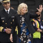 
              First lady Jill Biden, right, with U.S. Surgeon General Dr. Vivek Murthy, waves to FedEx employees during an event about the baby formula shortage Wednesday, May 25, 2022, in Chantilly, Va., at Dulles International Airport. (AP Photo/Jacquelyn Martin)
            