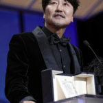 
              Song Kang-ho accepts the award for best actor for 'Broker' during the awards ceremony of the 75th international film festival, Cannes, southern France, Saturday, May 28, 2022. (Photo by Joel C Ryan/Invision/AP)
            