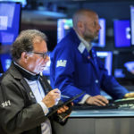 
              In this photo provided by the New York Stock Exchange, trader Sal Suarino, left, and specialist Meric Greenbaum work on the floor, Monday May 2, 2022. The subdued start to May follows a dismal April, where Big Tech companies dragged the broader market lower as they started to look overpriced, particularly with interest rates set to rise sharply. (Courtney Crow/New York Stock Exchange via AP)
            