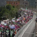 
              Protestors begin crossing the Brooklyn Bridge during an abortion rights demonstration, Saturday, May 14, 2022, in New York. Demonstrators are rallying from coast to coast in the face of an anticipated Supreme Court decision that could overturn women's right to an abortion. (AP Photo/Jeenah Moon)
            