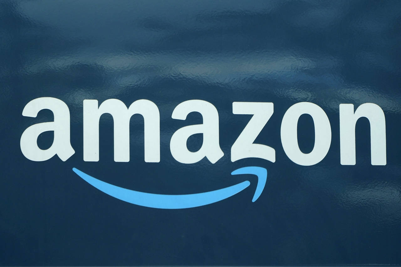 FILE - An Amazon logo appears on a delivery van, Oct. 1, 2020, in Boston.   A state agency in New Y...