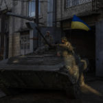 
              Ukrainian servicemen park a Russian BMP-2, an infantry combat vehicle, in the Kharkiv area, eastern Ukraine, Sunday, May 29, 2022. The Ukrainian military has been recovering abandoned Russian combat vehicles on the frontline to repair them and use them to their advantage. (AP Photo/Bernat Armangue)
            