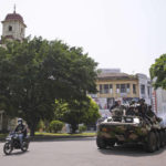 
              Sri Lankan army soldiers patrol during curfew in Colombo, Sri Lanka, Wednesday, May 11, 2022. Sri Lanka's defense ministry ordered security forces on Tuesday to shoot anyone causing injury to people or property to contain widespread arson and mob violence targeting government supporters.(AP Photo/Eranga Jayawardena)
            