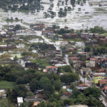 
              This May 30, 2022 handout photo provided by Brazil's Presidential Press Office, shows an aerial view over a flooded area after heavy rains in Recife, Pernambuco state, Brazil. Authorities in Pernambuco state said that at least 91 deaths have been confirmed from flooding over the weekend, with more than two dozen people still unaccounted for. (Clauber Cleber Caetano/Brazil's Presidential Press Office via AP)
            