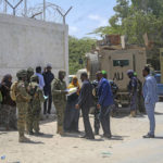 
              Somali lawmakers are checked by security forces as they arrive to cast their vote in the presidential election, at the Halane military camp which is protected by African Union peacekeepers, in Mogadishu, Somalia Sunday, May 15, 2022. Legislators in Somalia are meeting Sunday to elect the country's president in the capital, Mogadishu, which is under lockdown measures aimed at preventing deadly militant attacks. (AP Photo/Farah Abdi Warsameh)
            
