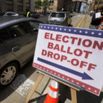 
              A voter arrives to cast their mail-in ballot at the City-County Building in downtown Pittsburgh Monday, May 16, 2022. (AP Photo/Gene J. Puskar)
            