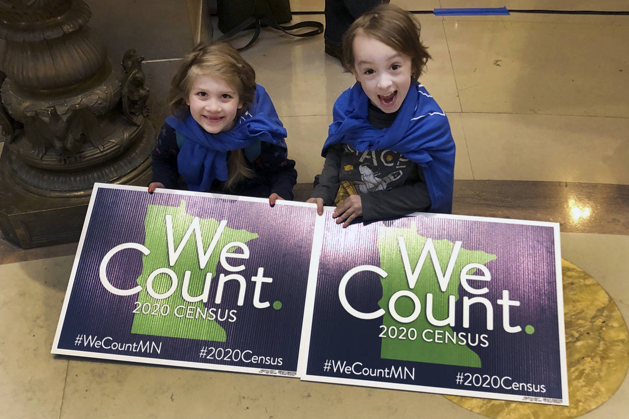 FILE - In this April 1, 2019, photo, Noelle Fries, 6, left, and Galen Biel, 6, both of Minneapolis,...