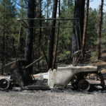 
              A burned golf cart is seen in an RV park following a wildfire near Las Vegas, New Mexico, on Monday, May 2, 2022. Wind-whipped flames are marching across more of New Mexico's tinder-dry mountainsides, forcing the evacuation of area residents and dozens of patients from the state's psychiatric hospital as firefighters scramble to keep new wildfires from growing. The big blaze burning near the community of Las Vegas has charred more than 217 square miles. (AP Photo/Cedar Attanasio)
            