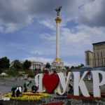 
              People plant flowers in Independence Square, downtown Kyiv, Ukraine, Monday, May 23, 2022. (AP Photo/Natacha Pisarenko)
            