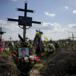
              The tomb of a person who died after Russia invasion is seen in Bucha cemetery, outskirts of Kyiv, Ukraine, Tuesday, May 24, 2022. (AP Photo/Natacha Pisarenko)
            
