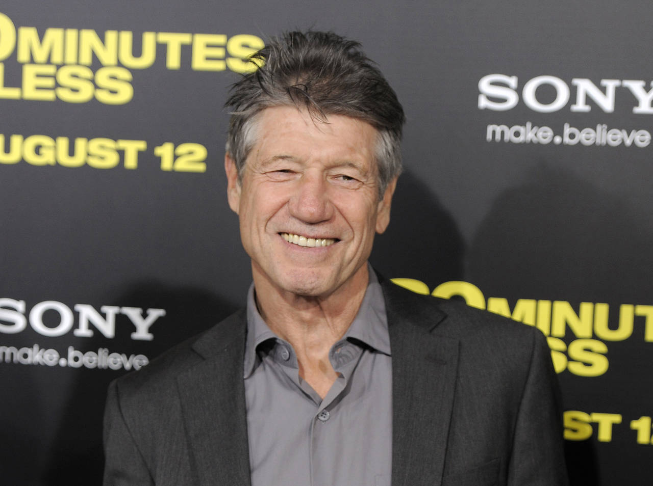 FILE - Fred Ward, a cast member in "30 Minutes or Less," poses at the premiere of the film in Los A...