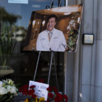 
              A photo of Dr. John Cheng, a 52-year-old victim who was killed in Sunday's shooting at Geneva Presbyterian Church, is displayed outside his office in Aliso Viejo, Calif., Monday, May 16, 2022. Authorities say a Chinese-born gunman was motivated by hatred against Taiwan when he chained shut the doors of the church and hid firebombs before shooting at a gathering of mainly of elderly Taiwanese parishioners. (AP Photo/Jae C. Hong)
            