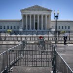 
              Pens for protesters are set up before anti-scaling fencing that blocks off the stairs to the Supreme Court, Tuesday, May 10, 2022, in Washington. (AP Photo/Jacquelyn Martin)
            
