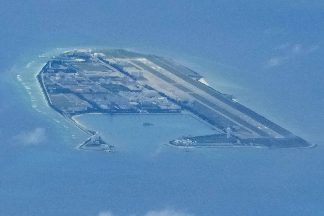 Chinese structures and buildings on the man-made Fiery Cross Reef at the disputed Spratlys group of...