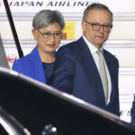 
              Australian Prime Minister Anthony Albanese, right, and Foreign Minister Penny Wong arrive at Haneda International Airport in Tokyo, Monday, May 23, 2022.  The newly sworn-in Australian Prime Minister Albanese is scheduled to attend a gathering in Tokyo of the four-country Indo-Pacific group known as the Quad.(Fumine Tsutabayashi/Kyodo News via AP)
            