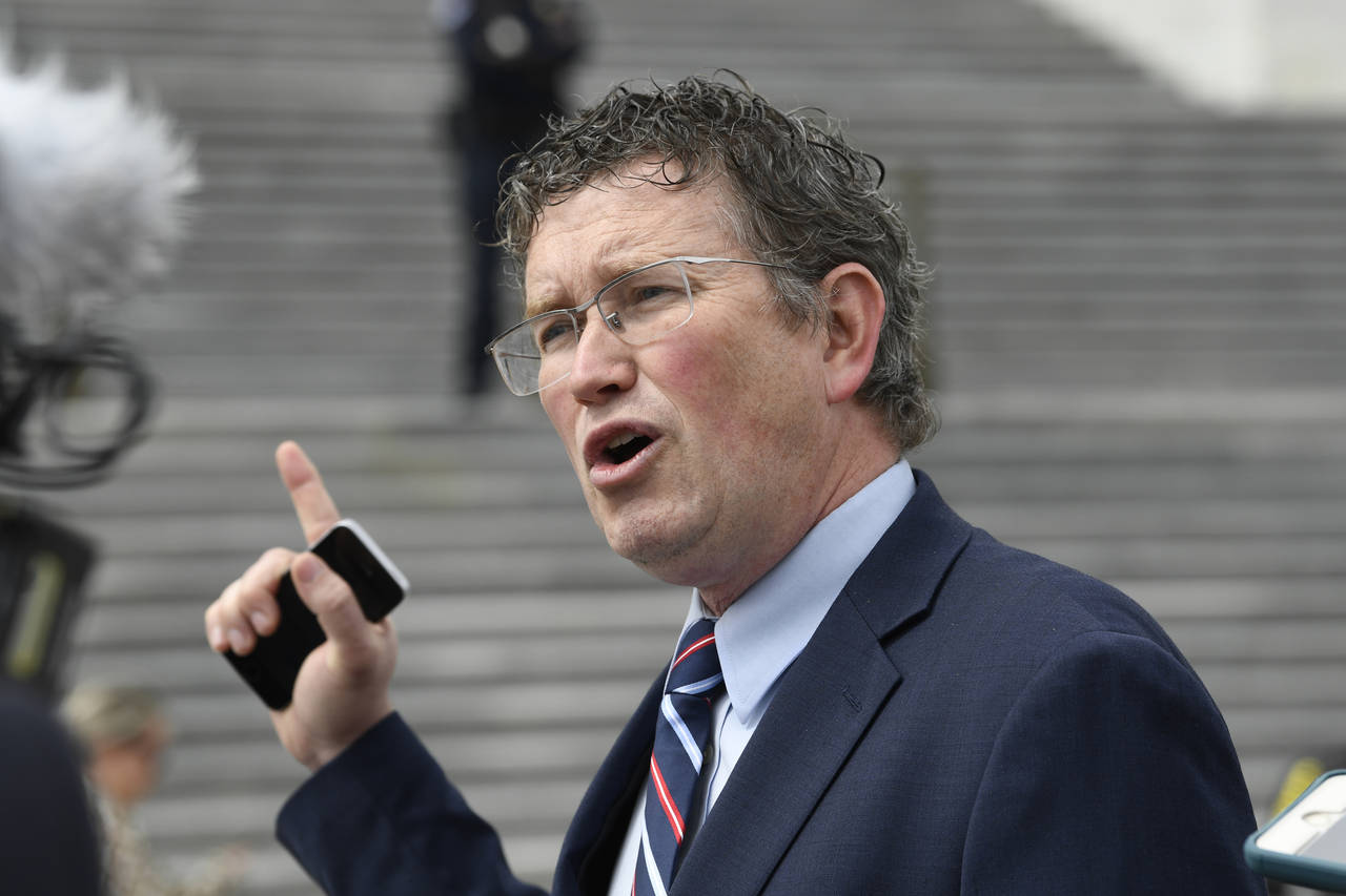 FILE - Rep. Thomas Massie, R-Ky., talks to reporters before leaving Capitol Hill in Washington, Mar...