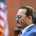
              Actor Johnny Depp looks on in the courtroom at the Fairfax County Circuit Courthouse in Fairfax, Va., Tuesday, May 24, 2022. Depp sued his ex-wife Amber Heard for libel in Fairfax County Circuit Court after she wrote an op-ed piece in The Washington Post in 2018 referring to herself as a "public figure representing domestic abuse." (Jim Watson/Pool photo via AP)
            