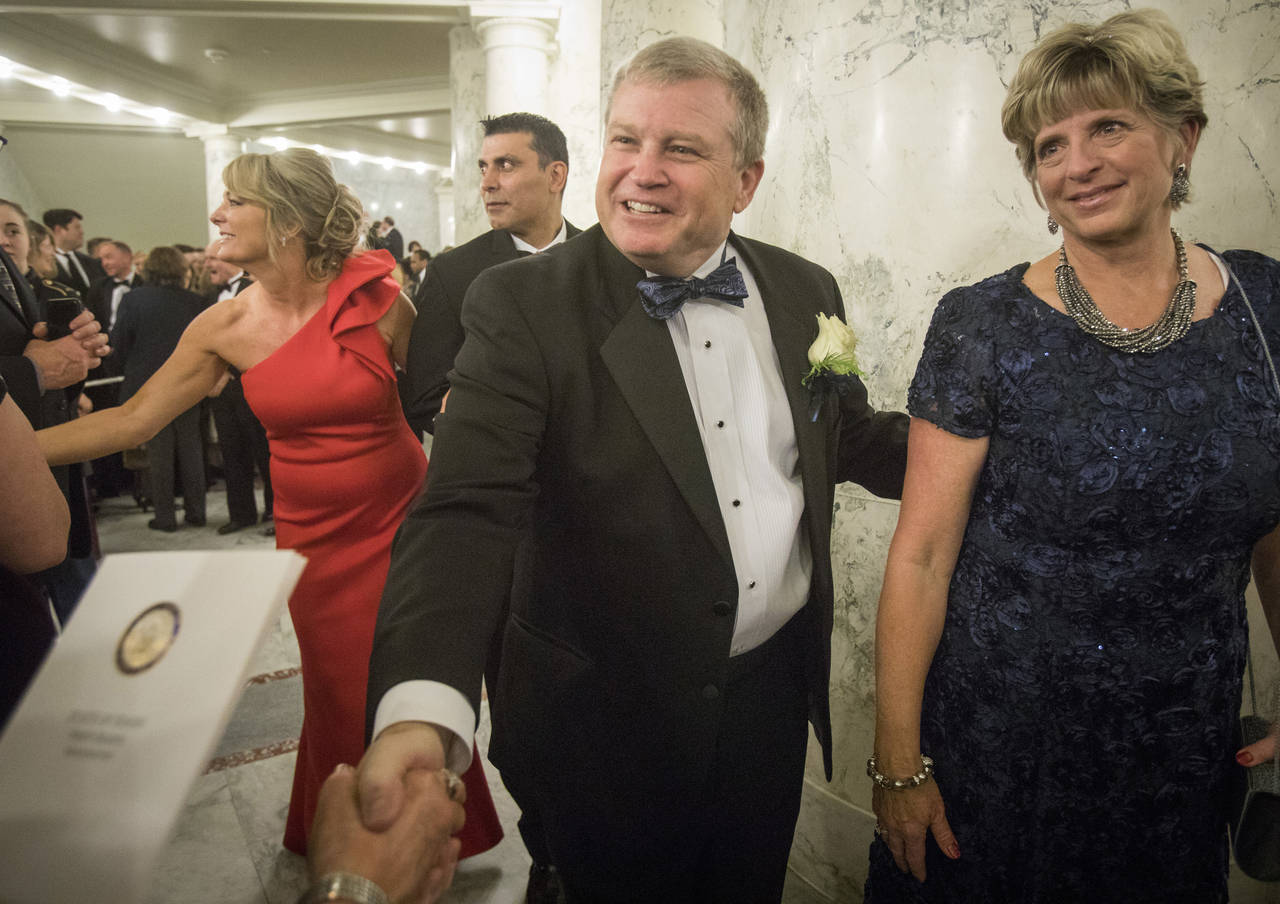 FILE - Idaho Attorney General Lawrence Wasden and his wife, Tracey Wasden, attend the Inaugural Pro...