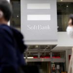 
              Passersby move past a SoftBank shop in Tokyo, Thursday, May 12, 2022. Japanese technology company SoftBank Group reported Thursday it has dropped into losses as the value of its investments declined. (AP Photo/Shuji Kajiyama)
            