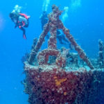 
              In this Sunday, May 15, 2022, photo provided by the Florida Keys News Bureau, divers swim near the bow of the retired Naval Landing Ship Dock Spiegel Grove, sunk 20 years earlier, six miles off Key Largo, Fla., to become an artificial reef. The vessel's storied past is to be celebrated May 17, 2022, the 20th anniversary of the sinking, with an event at a local cultural center that features key individuals reminiscing about the project. (Frazier Nivens/Florida Keys News Bureau via AP)
            