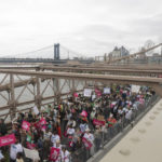 
              Protesters cross the Brooklyn Bridge during an abortion rights demonstration, Saturday, May 14, 2022, in New York. Demonstrators are rallying from coast to coast in the face of an anticipated Supreme Court decision that could overturn women's right to an abortion. (AP Photo/Jeenah Moon)
            