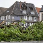 
              A view of the damaged roof of a residential building in Lippstadt, Germany, a day after heavy rains and storms hit the area, Saturday, May 21, 2022. (David Inderlied/dpa via AP)
            