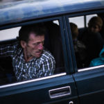 
              A man looks at his daughter as they arrive to a reception center for displaced people in Zaporizhzhia, Ukraine, Monday, May 2, 2022. Thousands of Ukrainians continue to leave Russian occupied areas. (AP Photo/Francisco Seco)
            