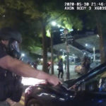 
              FILE - In this photo taken from police body camera video released by the Atlanta Police Department, an officer points his handgun at Messiah Young while the college student is seated in his vehicle, in Atlanta, Saturday, May 30, 2020. On Monday, May 23, 2022, a prosecutor said he would not prosecute Atlanta police officers involved in a May 2020 confrontation with two college students who were stunned with Tasers and pulled from a car while they were stuck in traffic caused by protests over George Floyd’s death. (Atlanta Police Department via AP, File)
            