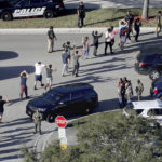 
              FILE - Students hold their hands in the air as they are evacuated by police from Marjory Stoneman Douglas High School in Parkland, Fla., on Feb. 14, 2018, after a shooter opened fire on the campus. Since 2012, a total of 73 students have been killed in school shootings with at least four victims shot and two victims killed, according to research by James Alan Fox, a criminologist at Northeastern University who studies mass killings. (Mike Stocker/South Florida Sun-Sentinel via AP, File)
            