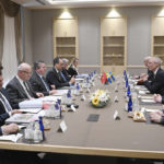 
              Ibrahim Kalin, the spokesman of President Recep Tayyip Erdogan, fifth from left, and Turkish delegation, left, speak with Swedish delegation headed by State Secretary Oscar Stenstroem, third right, in Ankara, Turkey, Wednesday, May 25, 2022. Senior officials from Sweden and Finland met with Turkish counterparts in Ankara on Wednesday in an effort to overcome Turkey's strong objections to the Nordic nations' bids to join NATO. Sweden and Finland submitted their written applications to join NATO last week.(Turkish Presidency via AP)
            