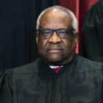 
              FILE - Justice Clarence Thomas sits during a group photo at the Supreme Court in Washington, on Friday, April 23, 2021. Thomas has been hospitalized because of an infection, the Supreme Court said Sunday, March 20, 2022. (Erin Schaff/The New York Times via AP, Pool, File)
            