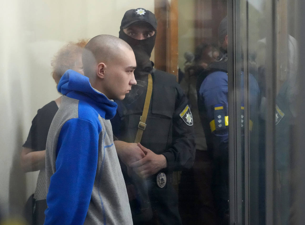 Russian army Sergeant Vadim Shishimarin, 21, is seen behind a glass during a court hearing in Kyiv,...