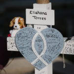 
              Eliahana Torres' cross stands at a memorial site for the victims killed in this week's shooting at Robb Elementary School in Uvalde, Texas, Friday, May 27, 2022. (AP Photo/Dario Lopez-Mills)
            